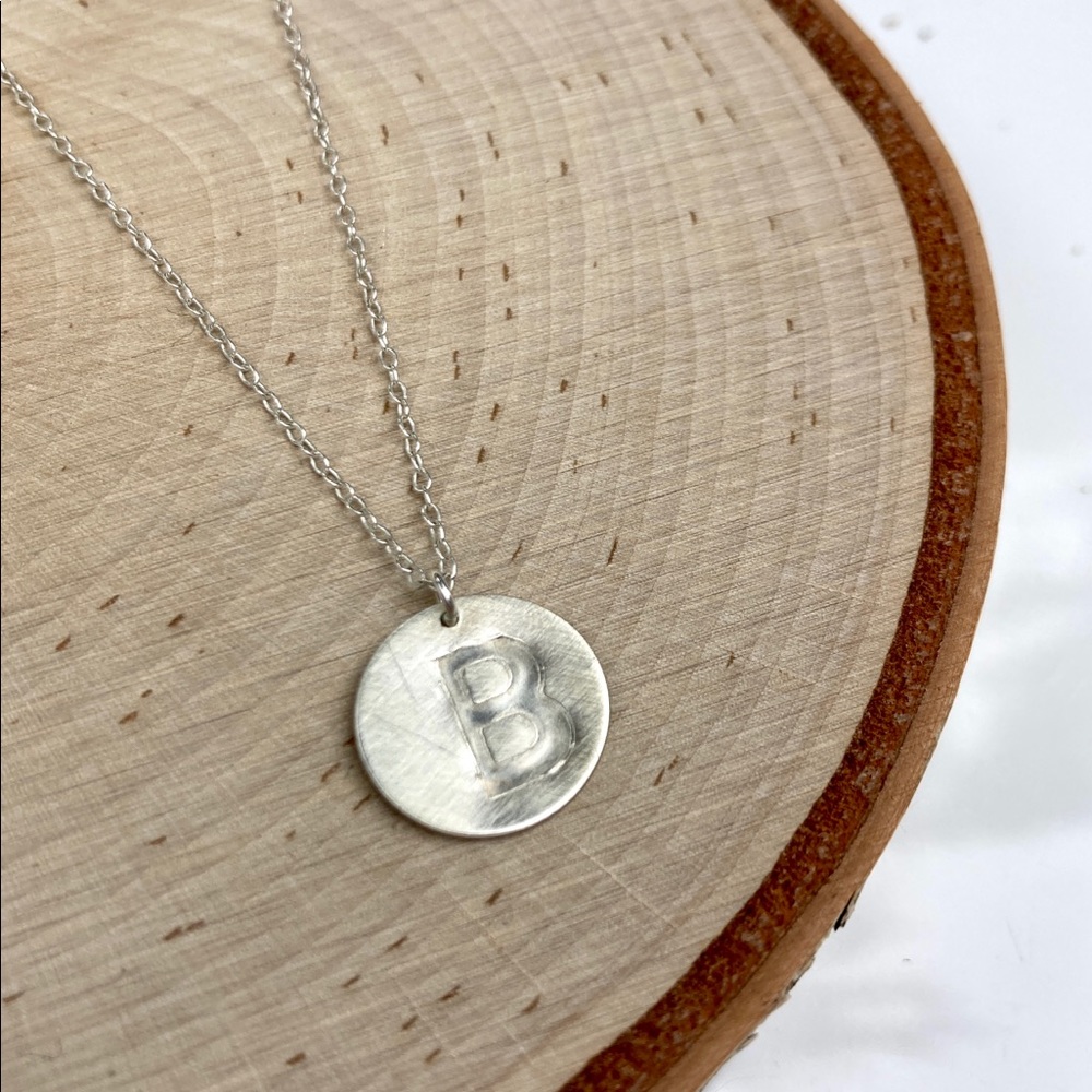 Sterling silver B pendant on a delicate adjustable chain with pearl accent.